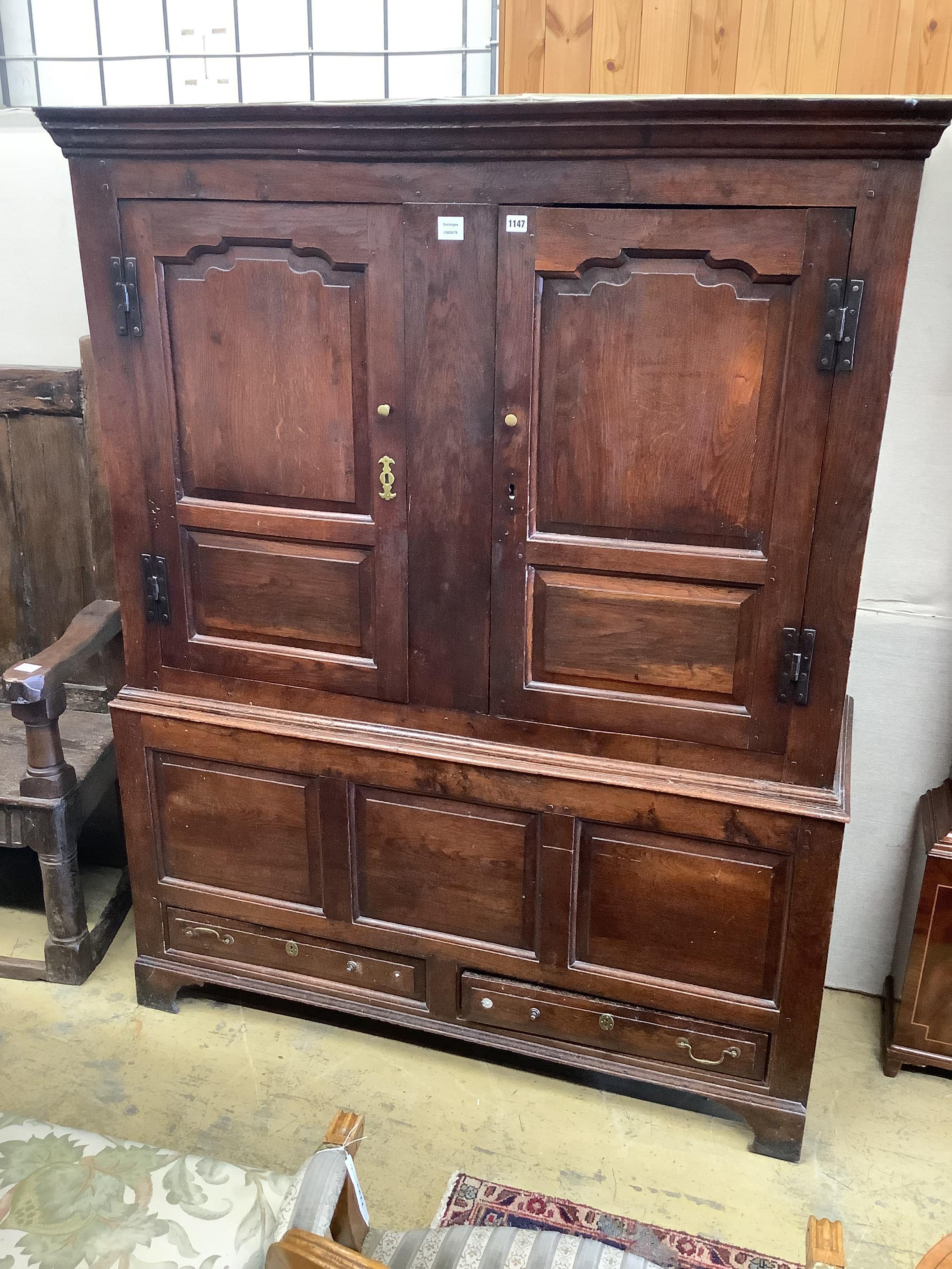 An 18th century panelled oak bacon cupboard